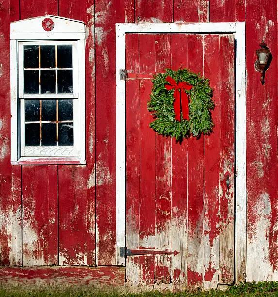 Photo of Christmas Wreath hanging on Red Barn Door