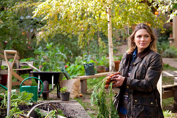 istock Young woman gardening 451792211