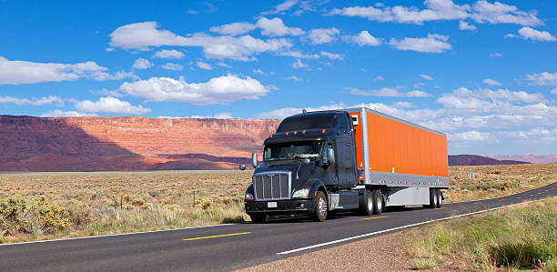 istock Blue sky over truck driving through Southwest USA 451800611