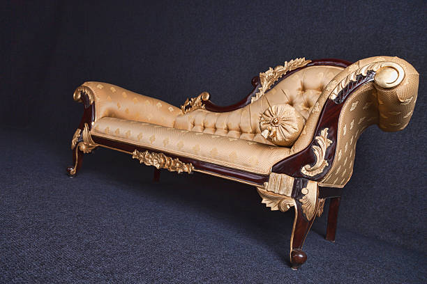 istock Gold Chaise Longue In A Dark Room 451800645
