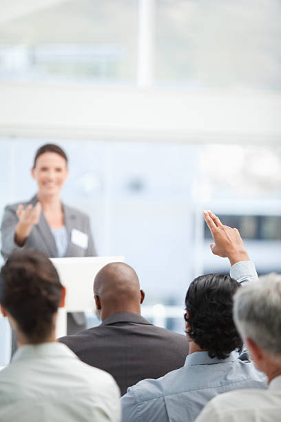 istock Businessman raising an arm while his colleague gestures towards 451801075