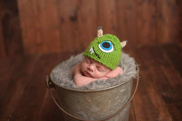 istock Sleeping Newborn In Bucket 451802519