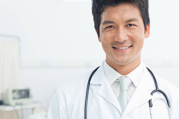 istock Smiling doctor looking ahead of him 451802955