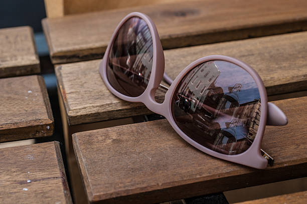 istock Violet glasses on a wooden table 451813593