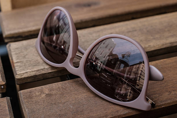 istock Violet glasses on a wooden table 451813911