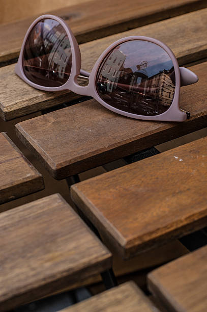 istock Violet glasses on a wooden table 451814093