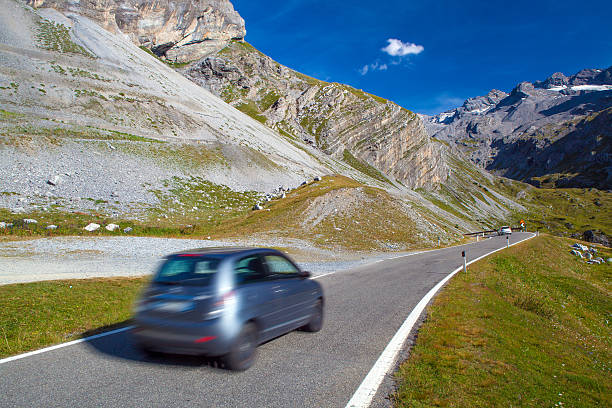 istock motion blurred car on a mountain road 451817745