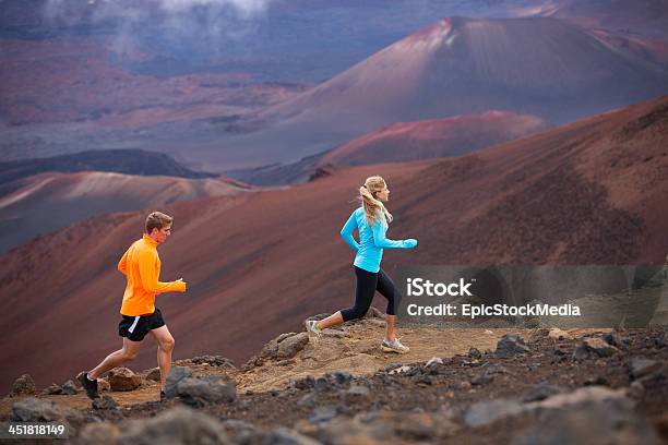 Active Sport Couple Running On Mountain Ridge Trail Stock Photo - Download Image Now