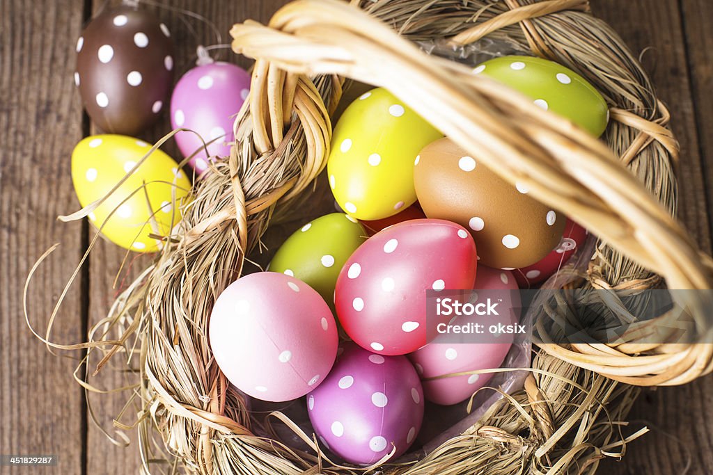 Easter eggs in basket Colorful polka dot eggs in basket, Easter decorations Animal Markings Stock Photo