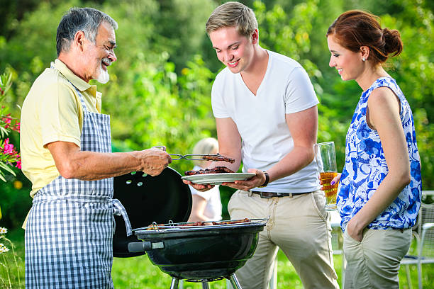 istock Family having a barbecue party together 451835517