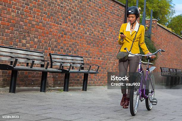 Young Women Pushing Her Bike In The City Stock Photo - Download Image Now - Bicycle, Cycling, Yellow