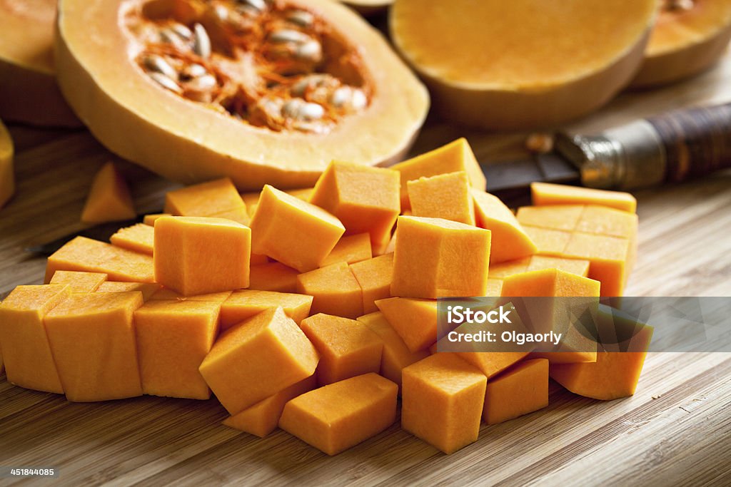 Orange long pumpkin cut into pieces Pumpkin Stock Photo