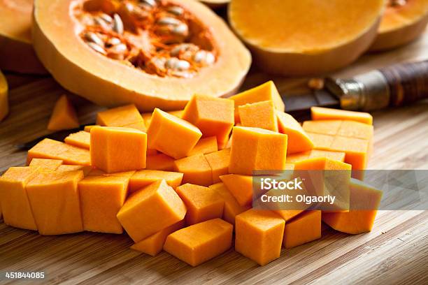 Orange Long Pumpkin Cut Into Pieces Stock Photo - Download Image Now - Pumpkin, Squash - Vegetable, Gourd