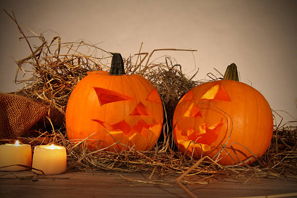 istock Halloween pumpkins in a forest at night 451844371