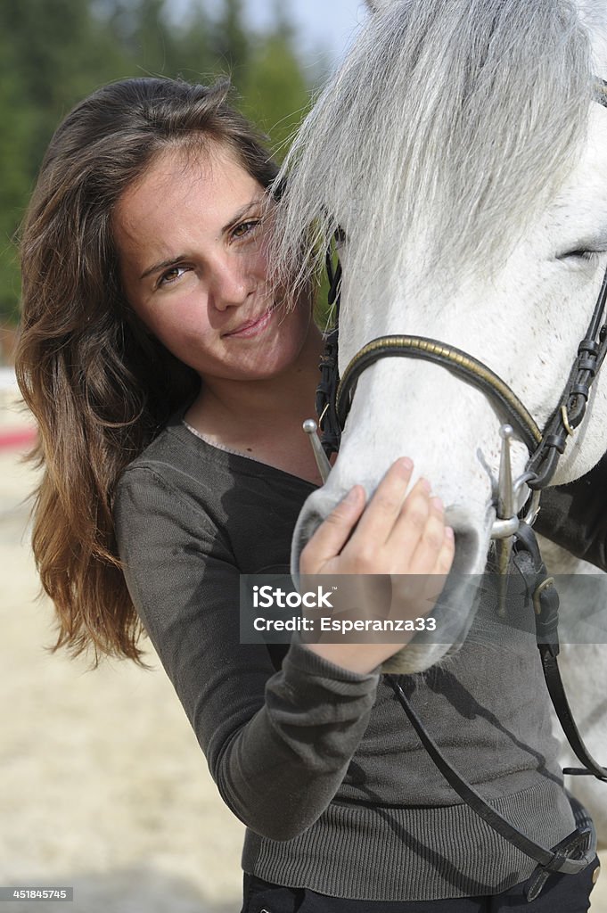 Woman playing with her horse 25-29 Years Stock Photo
