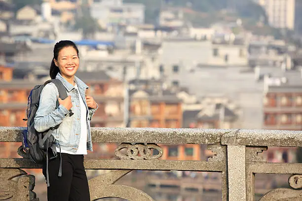 young asian woman tourist  at fenghuang anceint city,hunan province,china
