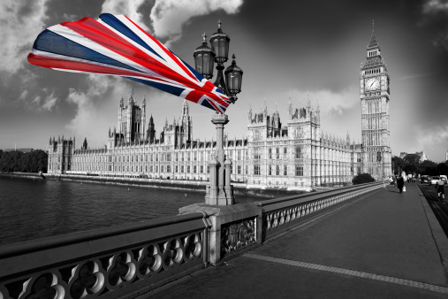 Famous Big Ben with flag of England, London, Uk