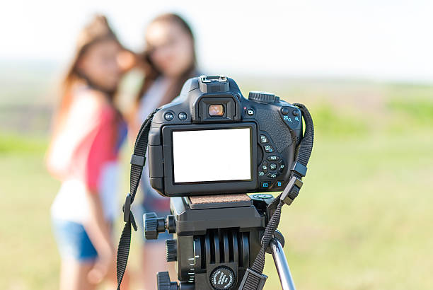 istock girl on screen of the camera 451856135