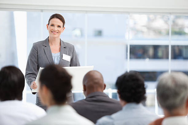 istock Businesswoman looking at her colleagues during a presentation 451856919