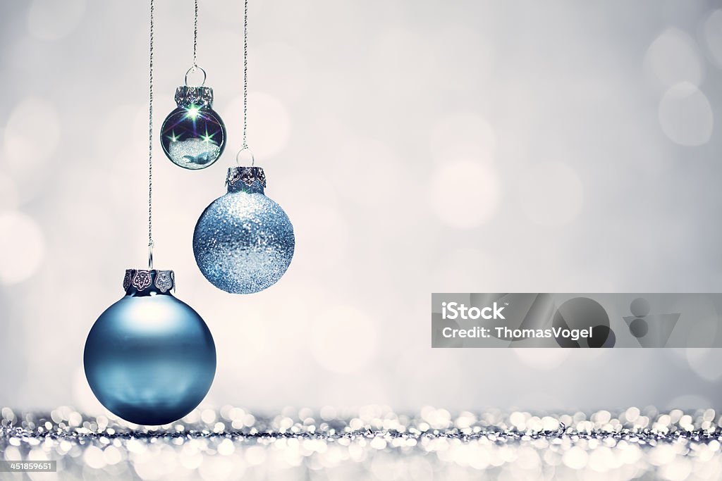 Three blue Christmas baubles with white background http://thomasvogel.eu/istock/is_christmas.jpg Christmas Ornament Stock Photo