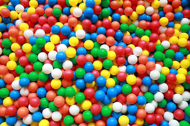 Colorful plastic balls in ball pit colorful plastic balls in ball pit competition group stock pictures, royalty-free photos & images