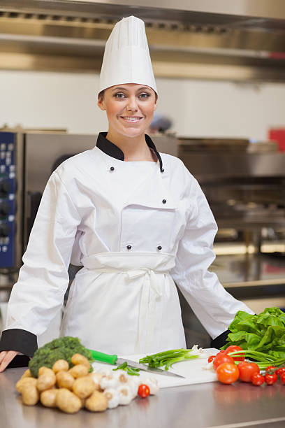 istock Chef looking up from slicing the vegetables 451861139