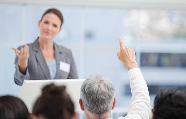 istock Mature businessman raising his arm while a colleague gestures 451861483