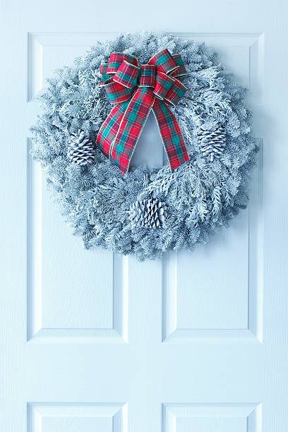 istock Christmas Wreath on White Door 451862695