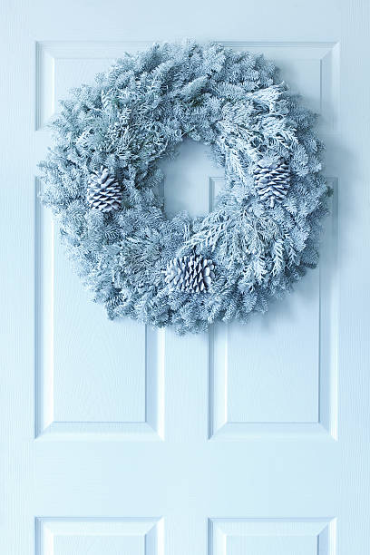 istock Christmas Wreath on White Door 451862751