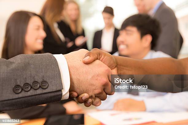 Business People Shake Hands During Office Meeting Stock Photo - Download Image Now