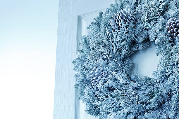 istock Christmas Wreath on White Door 451870515