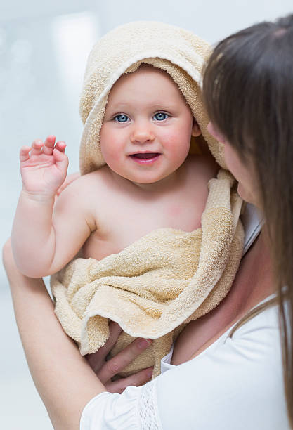 istock Mother with her baby in a towel 451870551