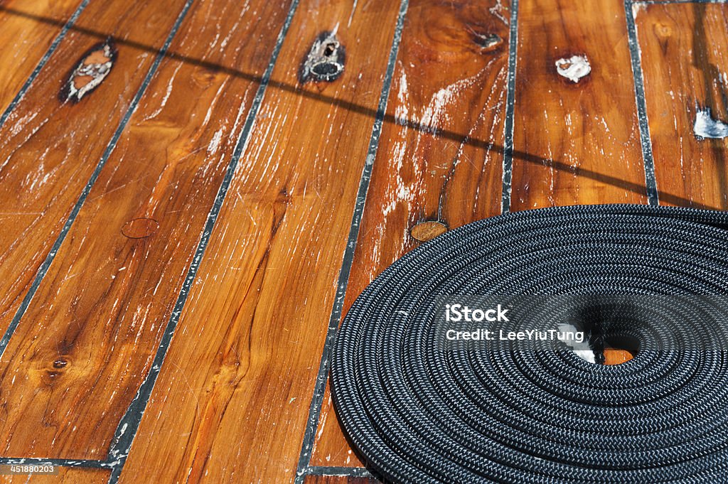 Deck Coiled rope on boat's deck Anchor - Vessel Part Stock Photo