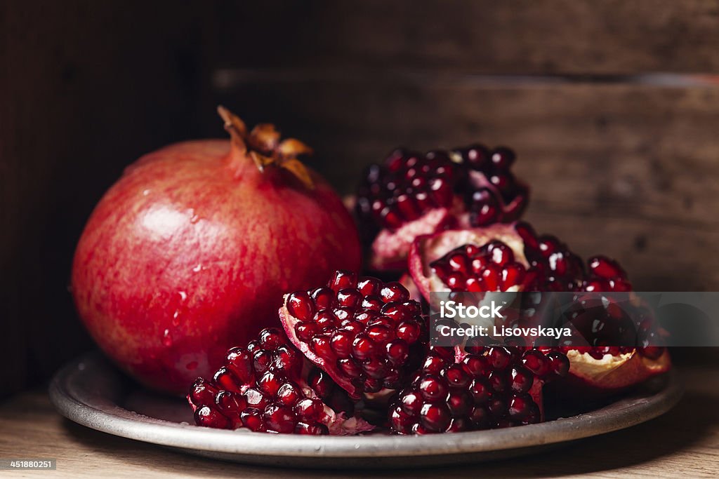 pomegranate Pieces and grains of ripe pomegranate Backgrounds Stock Photo