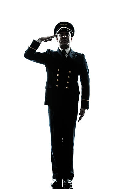 homem em uniforme de piloto de avião silhueta saudar - navy officer armed forces saluting imagens e fotografias de stock