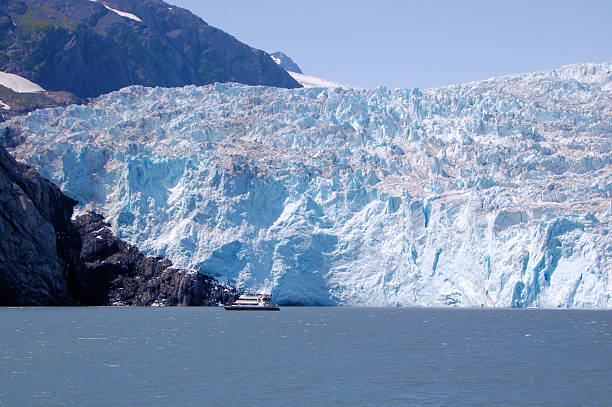 istock Tourist Boat in Front of a Huge Glacier 451885619