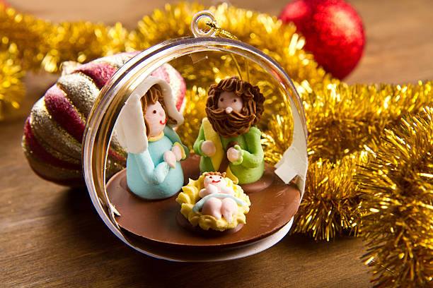 istock christmas decoration and crib on wooden table 451886333