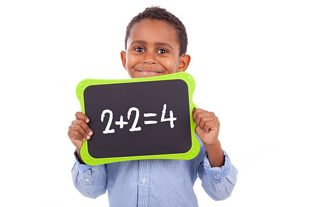 istock African American school boy holding a blank black board 451887203
