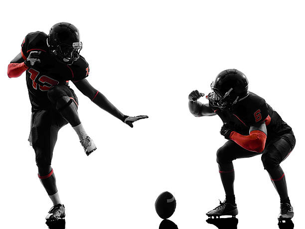 istock two american football players touchdown celebration silhouette 451888933
