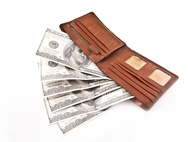 istock Brown leather wallet with dollars isolated 451890025