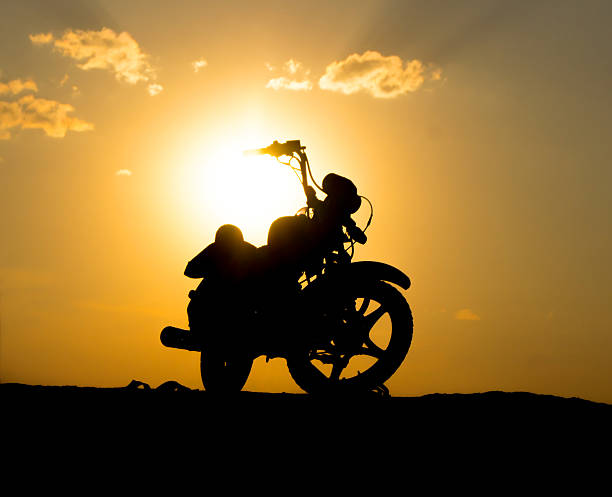 istock Silhouette  motorcycl on  background of dark sky 451894675