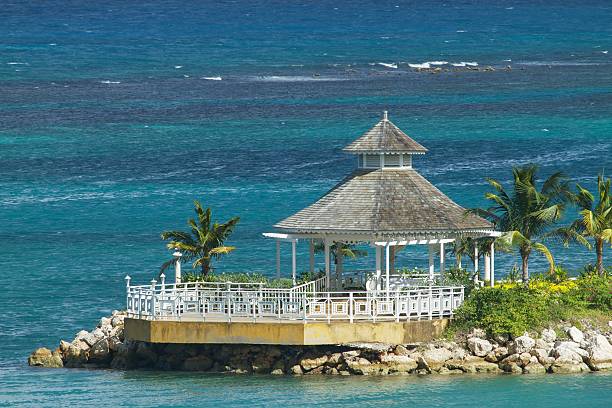 istock Beautiful lonely gazebo surrounded by the ocean. 451894943
