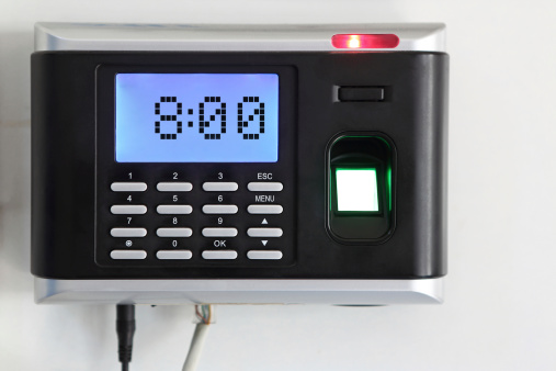 A fingerprint scanner that is being used as a time clock. 8:00 o'clock time is displayed on lcd screen.