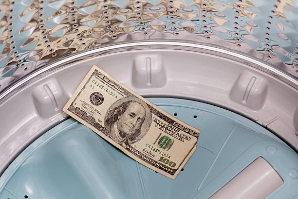 istock Money in washing machine 451908845
