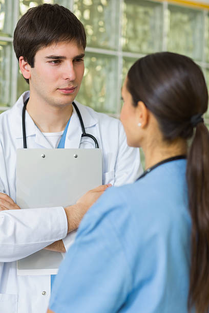 istock Doctor and nurse looking at each other 451909819