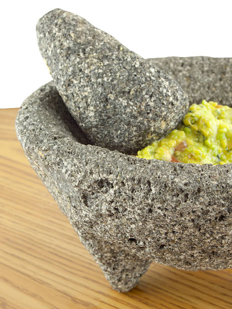 istock Molcajete Mortar And Pestle Bowl Filled With Guacamole 451911991