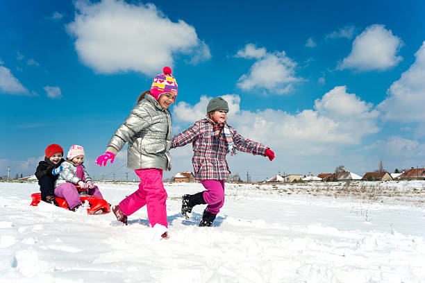 children on snow stock photo