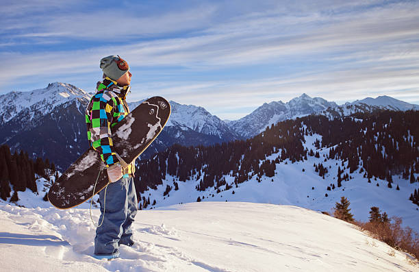 istock Sport man in snowy mountains at sunset 451919955