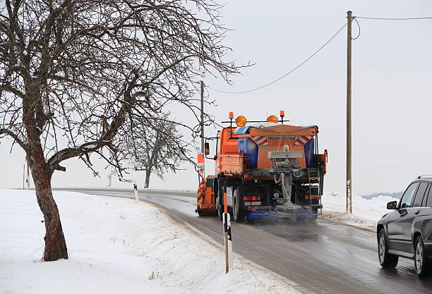 istock Snow plow on the icy road. 451920125