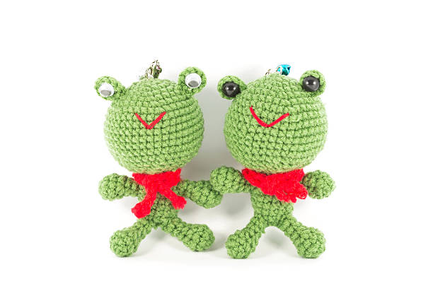 istock handmade crochet two green frog doll on white background 451923049